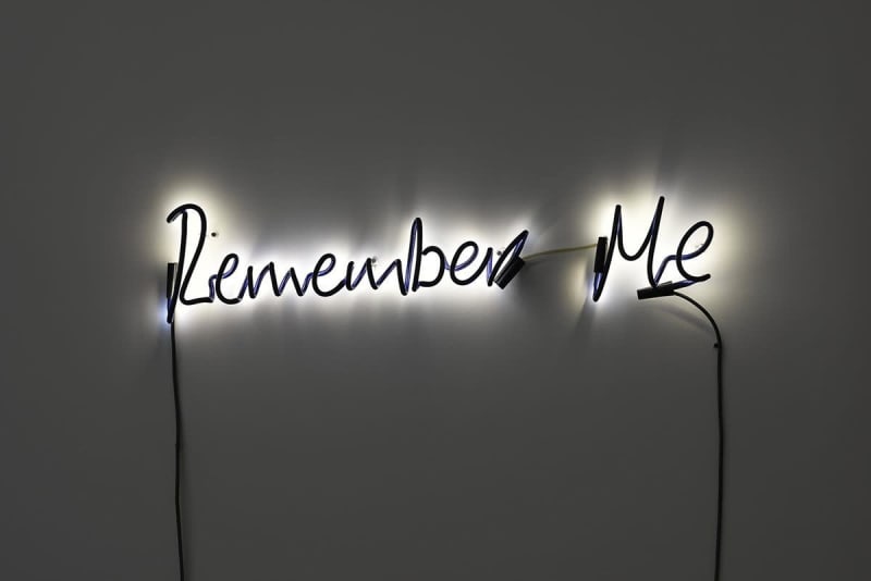 A neon sculpture by Steve McQueen that reads "Remember Me."