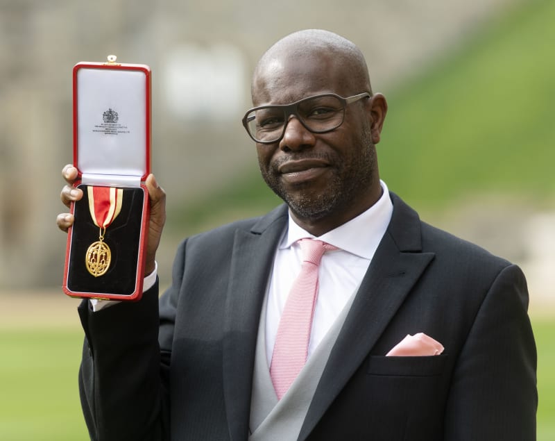Steve MᶜQueen at his knighthood ceremony at Windsor Castle. Credit: © Geoff Pugh.