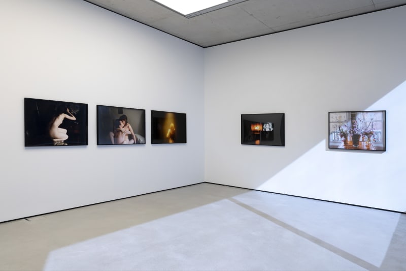 installation view of photographs by Nan Goldin