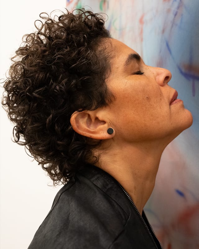 Julie Mehretu in front of Rise (Charlottesville). Mehretu wears a Rick Owens jumpsuit; her own jewelry. Hair and makeup by Maryia Tychynskaya.