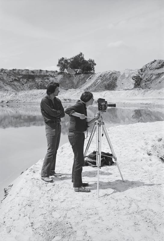 Smithson and Holt in the Netherlands in 1971, shooting film at Smithson’s earthwork “Broken Circle/Spiral Hill,” completed that same year. Credit...© Holt/Smithson Foundation, licensed by VAGA at ARS, New York