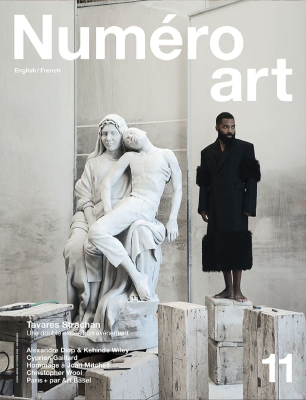 Tavares Strachan, wearing Prada, next to his sculptures - as featured on the cover of Numéro Art