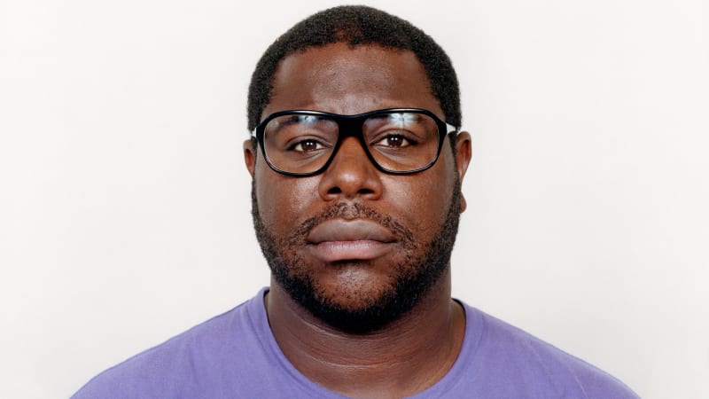 Close up photo portrait of artist Steve McQueen.