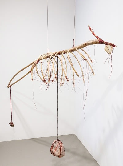 Zai Kuning Fisherman don't feed and weigh the pebbles to feed their children 2015 Wax, rattan, string, stones H151 x 158 x 37cm