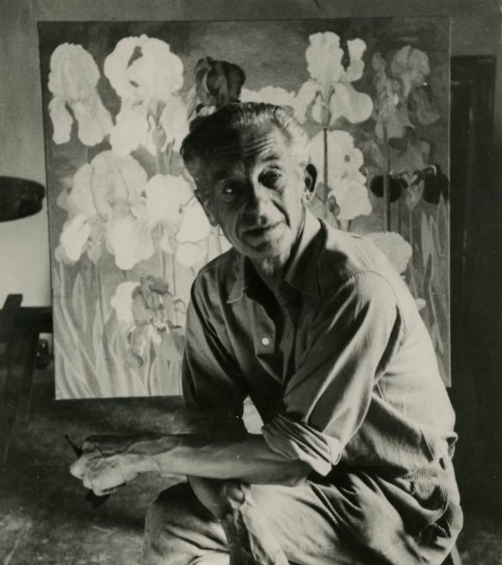 Photograph of Cedric Morris with one of his paintings of Tall Bearded irises, by Kurt Hutton, published in The Sunday Times 1958