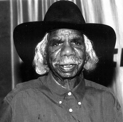 A black and white photo of Aboriginal-Australian artist Long Tom Tjapanangka, represented by Rebecca Hossack Art Gallery