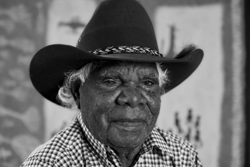 A black and white photo of Aboriginal-Australian artist Ngarralja Tommy May represented by Rebecca Hossack Art Gallery