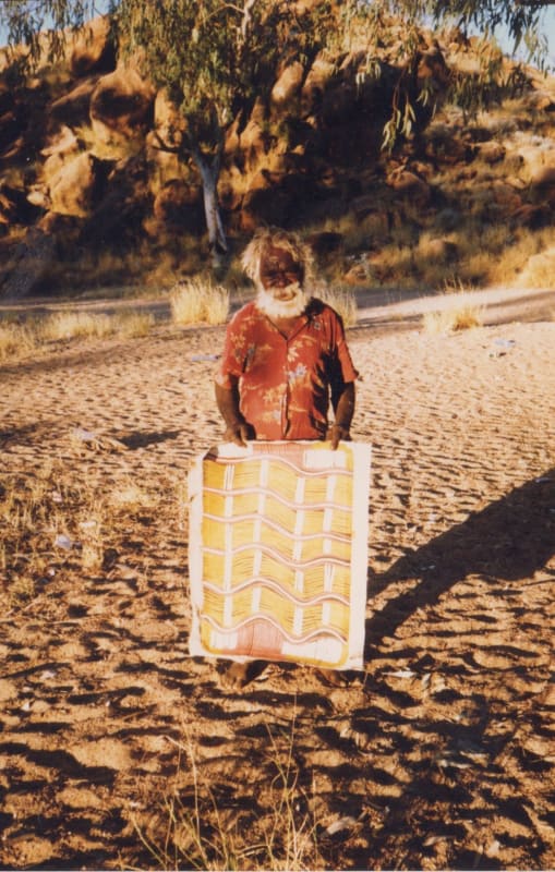 Billy Stockman with his painting at Papunya during one of Rebecca's visits