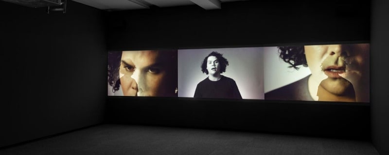 Christian Thompson, Berceuse (2017), three-channel digital video, installation view Monash University Museum of Art, 2017. Photography: Andrew Curtis.