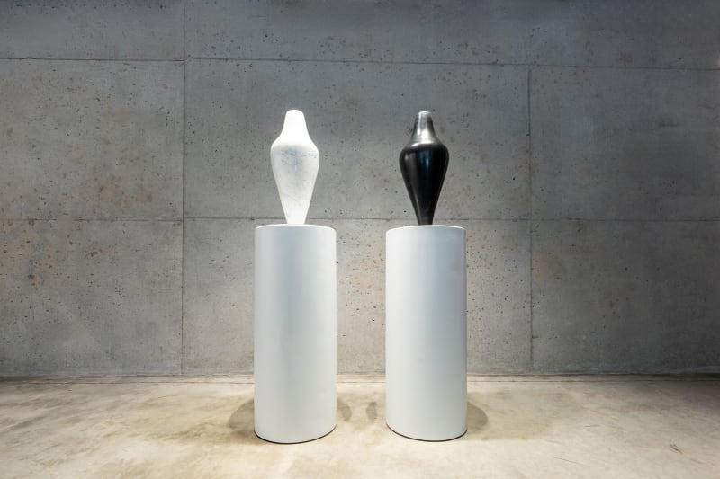 M’barek Bouhchichi. Saadia. 2025. Black Aziza marble and white Carrara marble. 62 h x 23 diam cm each. Image courtesy of the artist and Selma Feriani