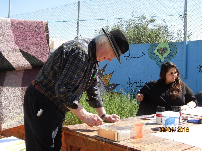 John Behan working with refugees at Eleonas camp in Athens during an earlier visit this year.