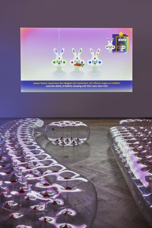 image of a video projection and plastic furniture