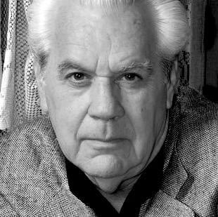 Black and white portrait photograph of photographer, Roberto Salas.