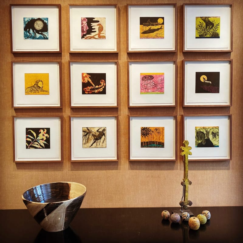 The set of twelve etchings hanging in our gallery
