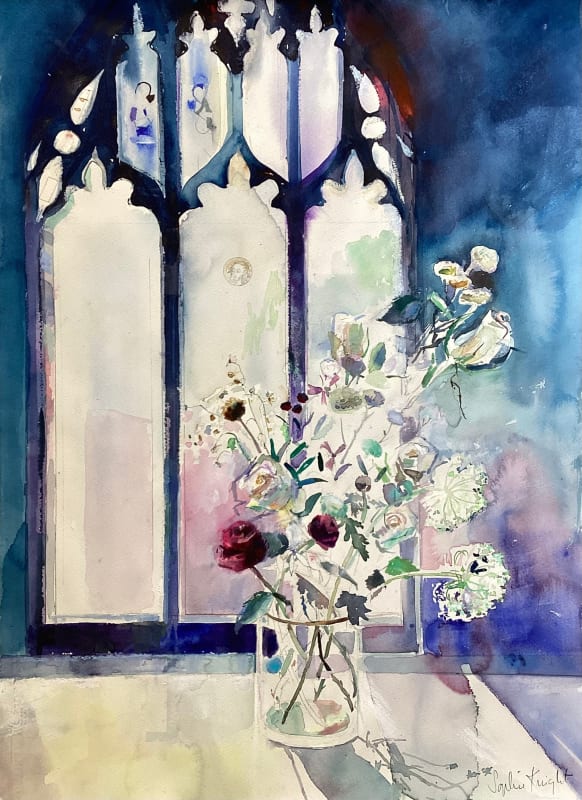 Ranunculus and white roses in light from stained glass window