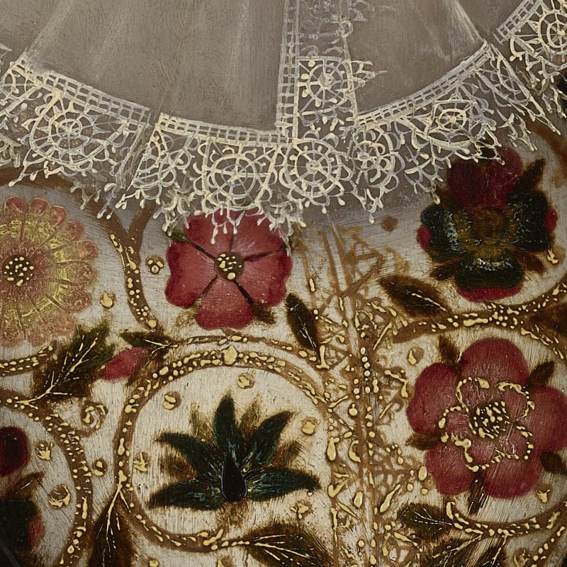 detail of embroidery on a 16th century portrait painting of flowers and lace