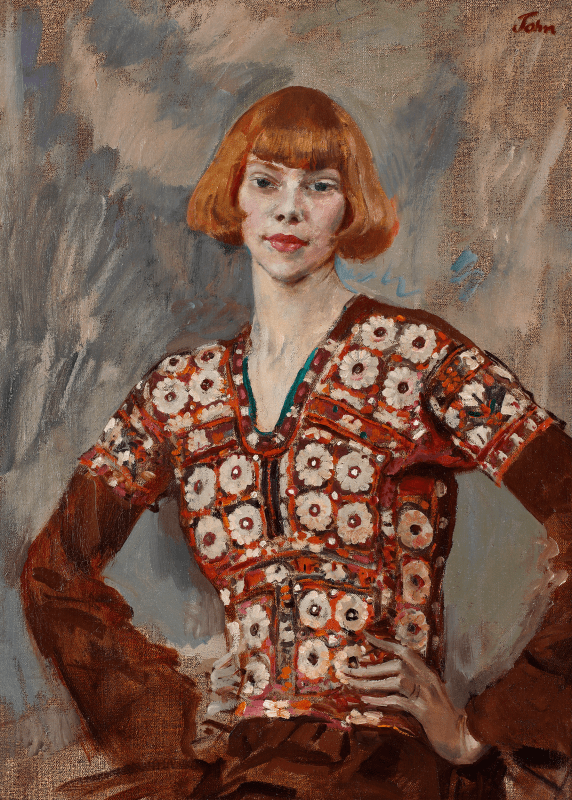 a portrait of poet Iris Tree in a patterned red and white crochet top, against a blue and grey background.