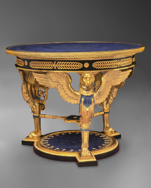 An Italian Empire style gilt bronze and lapislazuli-veneered center table, date circa 1980