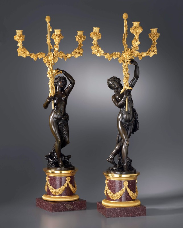 A pair of Louis XVI three-light figural candelabra after a model attributed to Clodion, Paris, date circa 1780-85