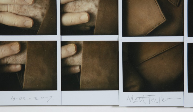 Detail of the mosaic composed of polaroids with date and signature of the artist.