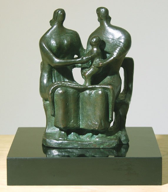 Two seated women and a child