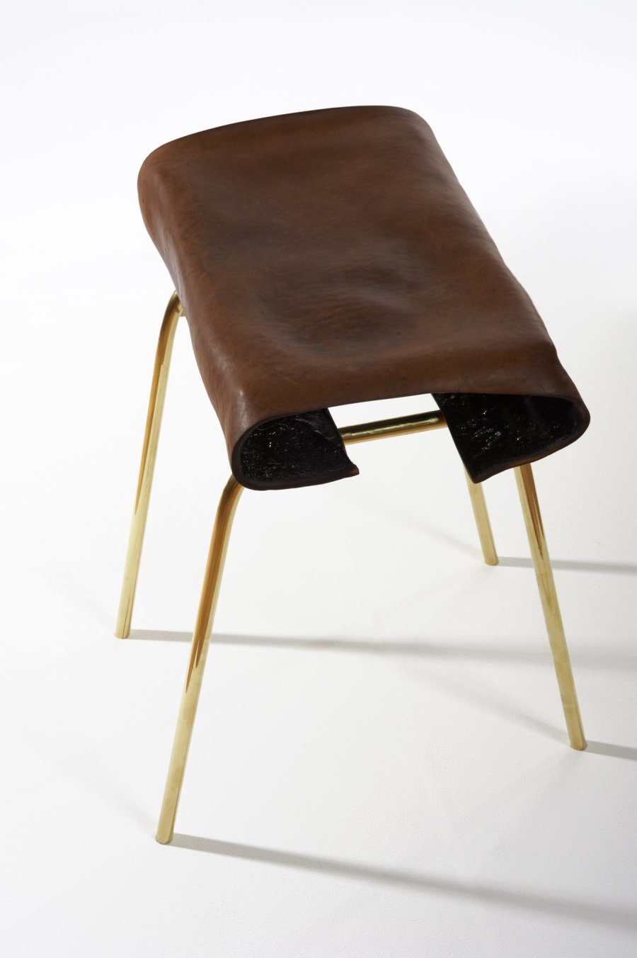 <p><strong>Simon Hasan</strong>, Geno Stool, 2011</p><p>Leather, brass</p><p>37.5 W x 25 D x 50 H cms</p><p>Edition of 24 plus 2 Artist's Proofs</p><p>Photography by Gideon Hart</p>