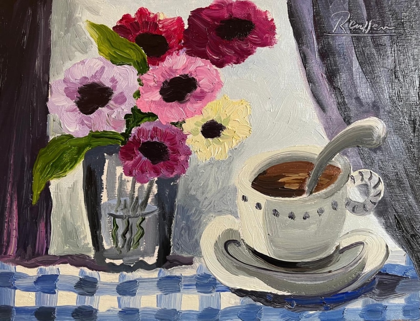 Flowers in a vase and cup of coffee