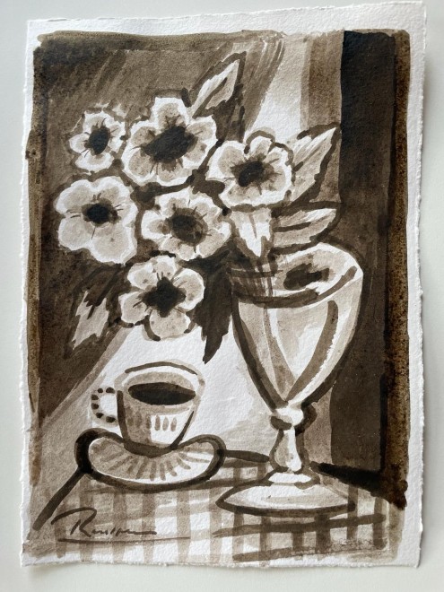 Cup and saucer with flowers in a vase