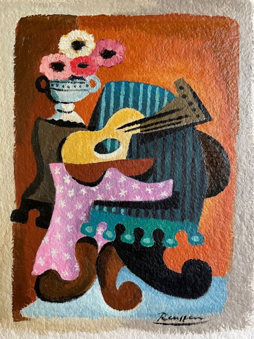 Flowers and guitar on a table