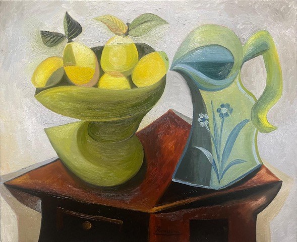 Lemons and pitcher on a table