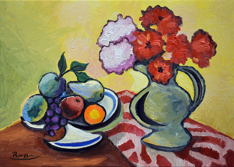 Pitcher with fruit and flowers on a table
