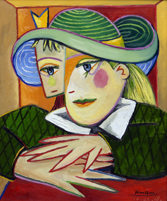 Woman in a green hat behind her desk