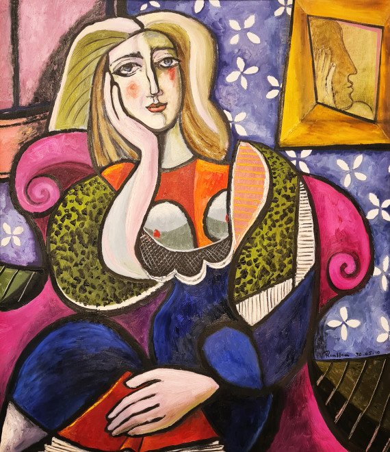 Woman with a book in a pink chair