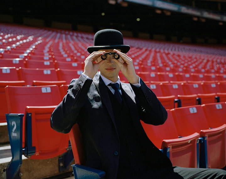 Andrew Seated in Stadium, New York, New York