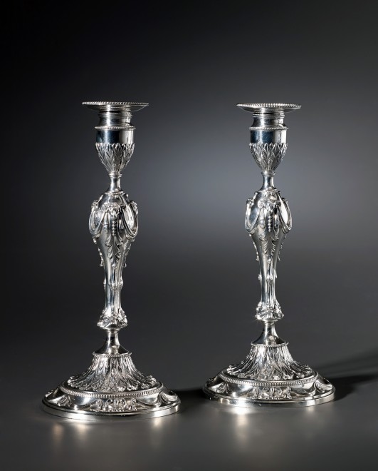 A pair of English candlesticks by Georges Cowles