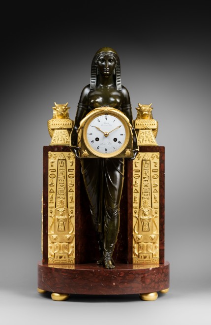 An Empire Pendule à L'Egyptienne, movement by Mesnil, case by Ravrio