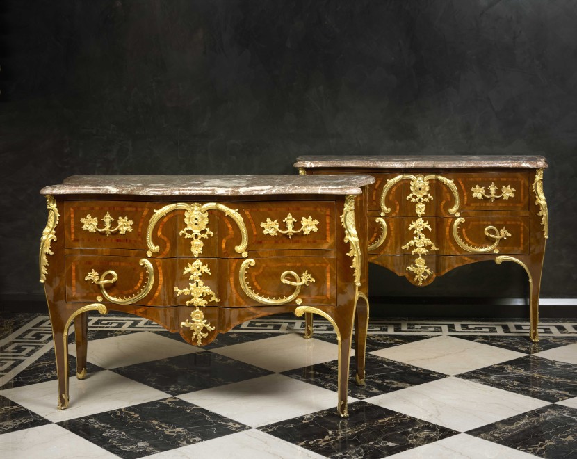 A pair of late eighteenth early nineteenth century Rococo style  commodes after Charles Cressent