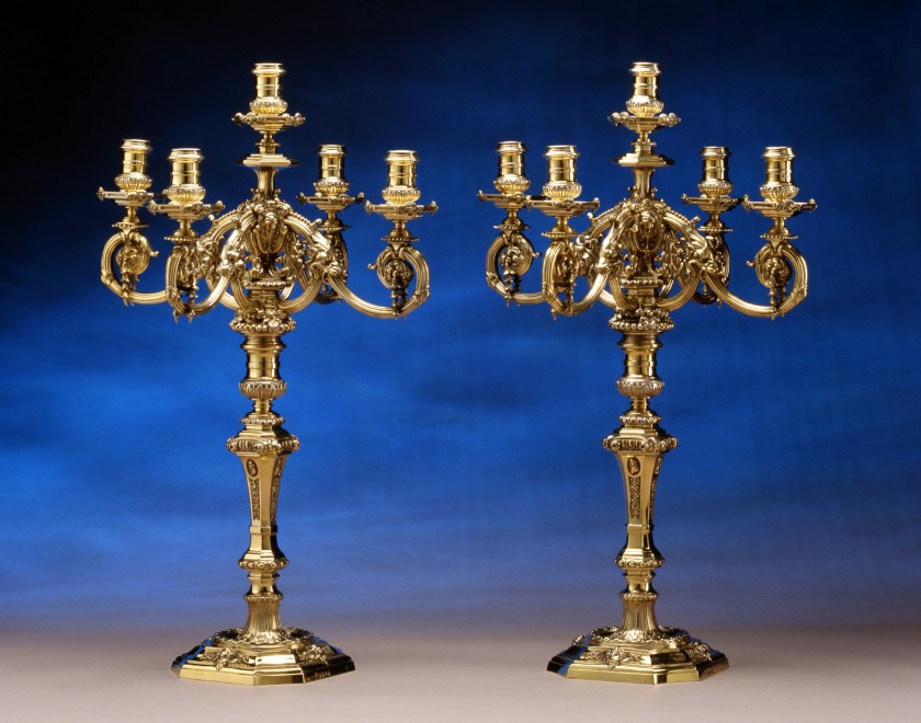 A pair of Victorian silver gilt five light candelabra in the George II manner, by Robert Garrard