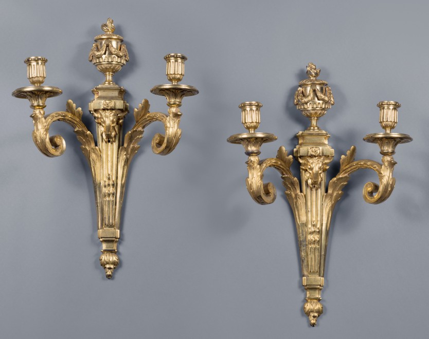 A pair of Louis XVI two-light wall-lights in the style of Jean-Charles Delafosse