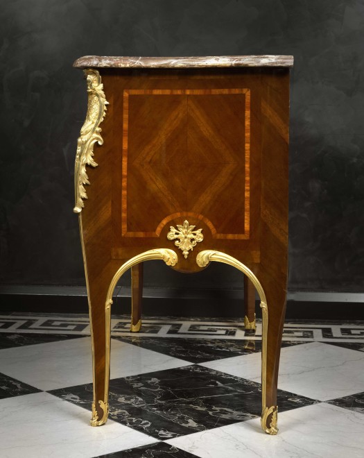 A pair of late eighteenth early nineteenth century Rococo style  commodes after Charles Cressent