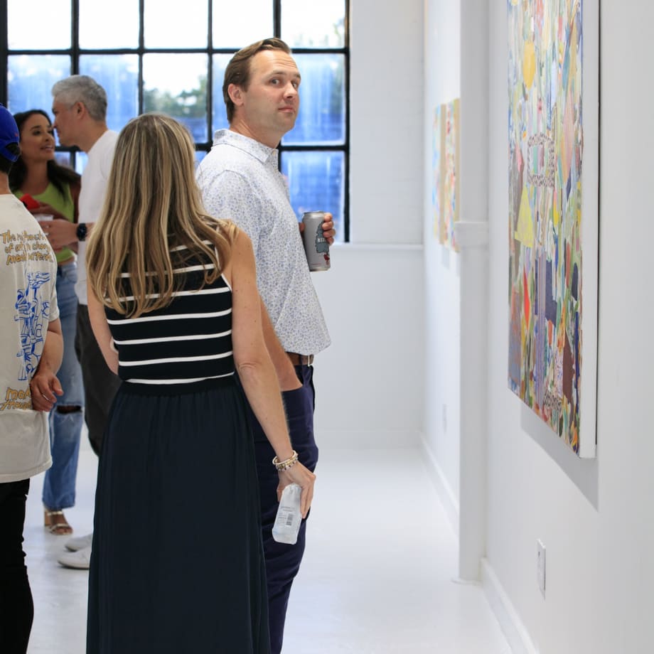 Guests at the opening reception of "Tiger Moth", a solo exhibition by Sarah Giannobile. Photo by Suzy Gorman