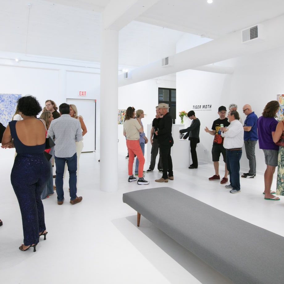 Guests at the opening reception of "Tiger Moth", a solo exhibition by Sarah Giannobile. Photo by Suzy Gorman