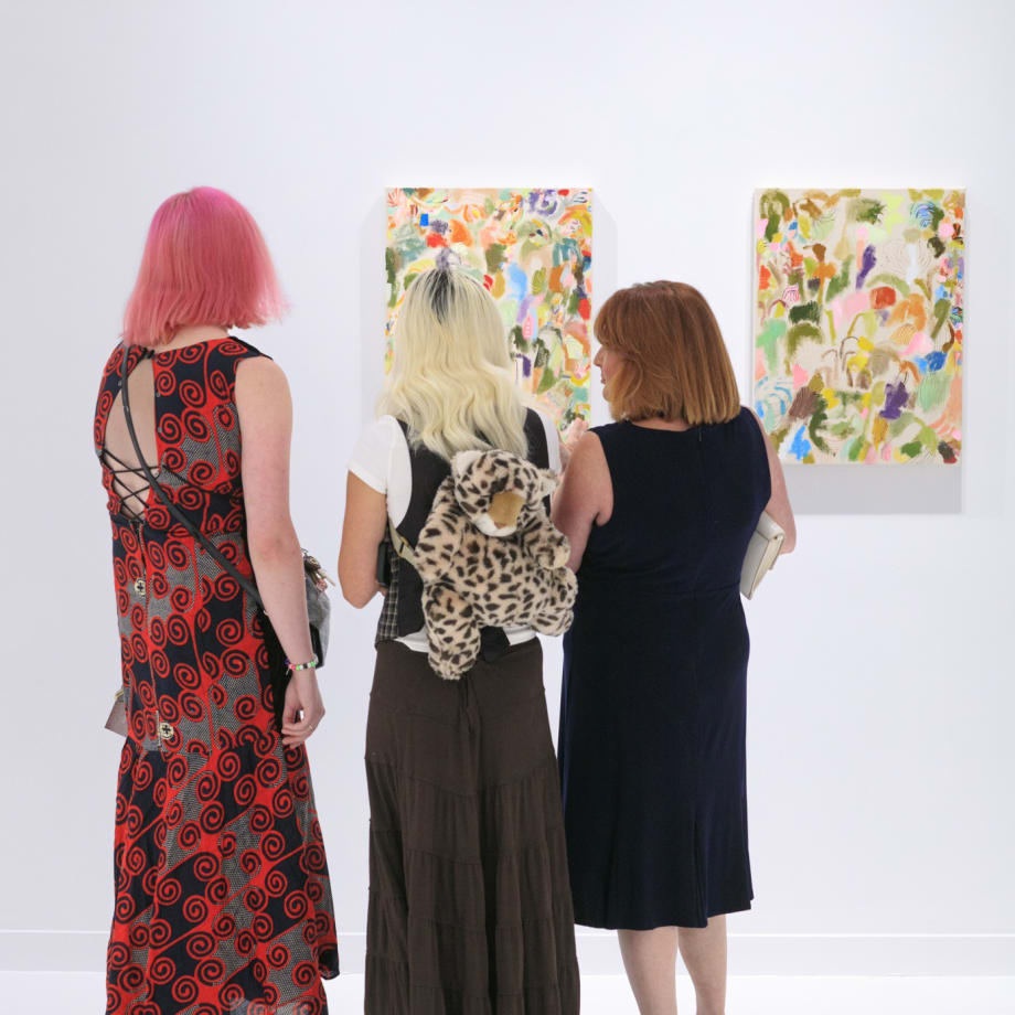 Guests at the opening reception of "Tiger Moth", a solo exhibition by Sarah Giannobile. Photo by Suzy Gorman