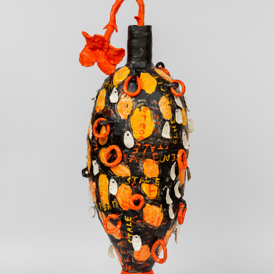 Large black and orange floor standing vase with orange flower by Xanthe Somers