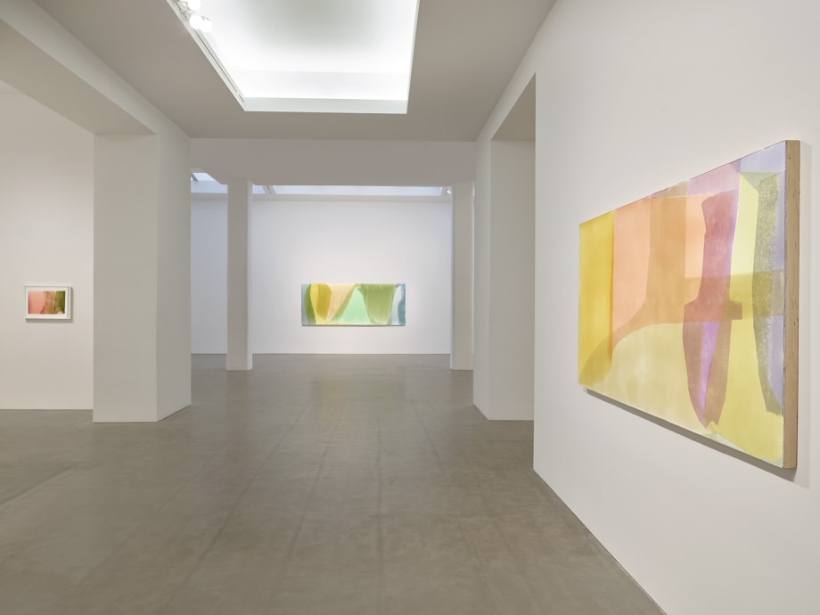 installation view of a contemporary art gallery featuring abstract paintings.