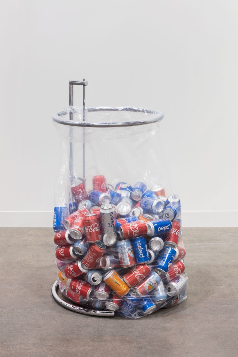 Recycling Sculpture (Eileen Gray Table), 2018  reproduction Eileen Gray E-1027 Table, plastic recycling bag, replenished recyclables  dimensions variable