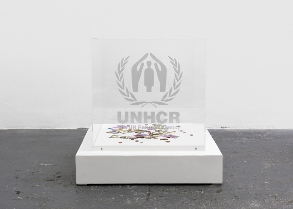 Contribution Cube (UNHCR), 2004/2016  plexiglass vitrine, vinyl sticker, wood base  79.0 x 76.0 x 76.0 cm 31 1/16 x 29 7/8 x 29 7/8 in.