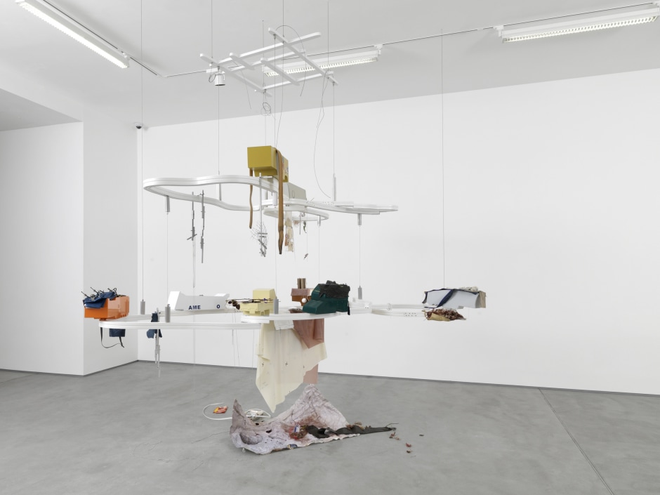 Helen Marten  Full of frozen food, 2014  Welded, bent and powder coated stainless steel; hardwood; tray; leaves; perfume bottle; printed Tyvek; ballchain; dried flowers; sandblasted aluminium; oyster shells; beetles; vinyl; stitched fabric; zips; welded chromed nuts and bolts; eggs; latex; water  302.5 x 273.0 x 210.0 cm 119 1/16 x 107 7/16 x 82 5/8 in.  © Helen Marten. Courtesy the Artist and Sadie Coles HQ, London.  Photo: Annik Wetter