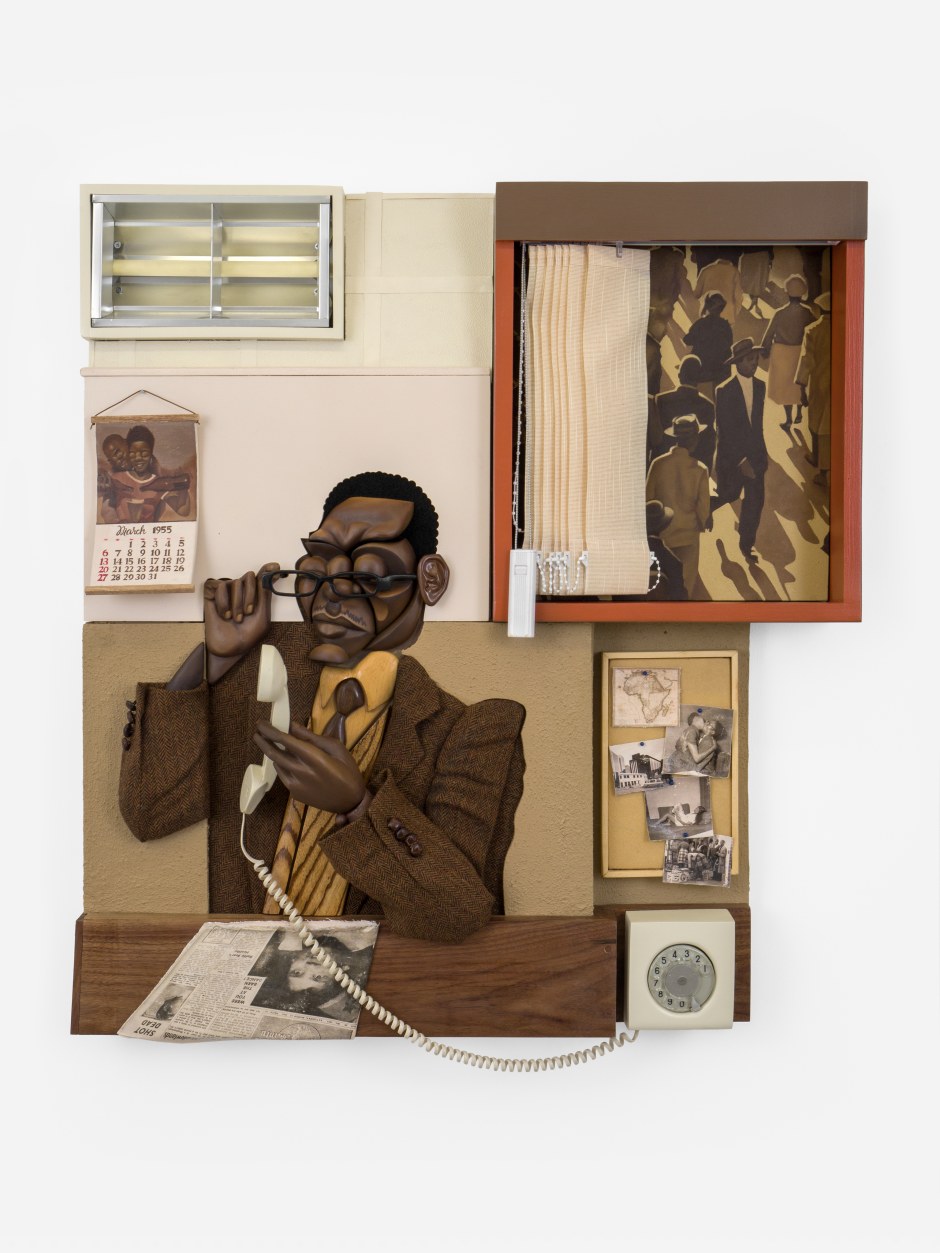 70 years ago, 2025  Jelutong, pine, walnut, zebrano, beech, MDF, bending ply, birch, oil, aerosol paint, acrylic, epoxy clay, 3D printed eyewear, telephone parts, carpet texture, photo transfer on canvas, blinds, light fixture, ceiling boards, tweed suit, felt  103 x 95 x 23 cm / 40 ½ x 37 ⅜ x 9 in.  © Dada Khanyisa. Courtesy the Artist and Sadie Coles HQ, London.  Photo: Katie Morrison