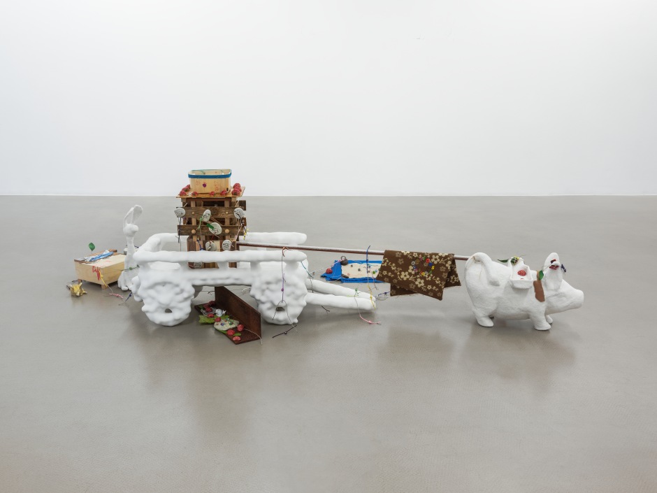 The Melancholy of Resistance, 2022  cast resin with marble dust, cast painted pewter, eye hooks, string, cotton, tea bag labels, gemstones, wooden fruit box, dry transfers, cellophane candy wrappers, mixed hardwoods, cast plaster, foil, glass beads, paper, fabric, embroidery, steel  58 x 211 x 131 cm / 22 ⅞ x 83 ⅛ x 51 ⅝ in  © Helen Marten, courtesy Sadie Coles HQ, London  Photo: Eva Herzog